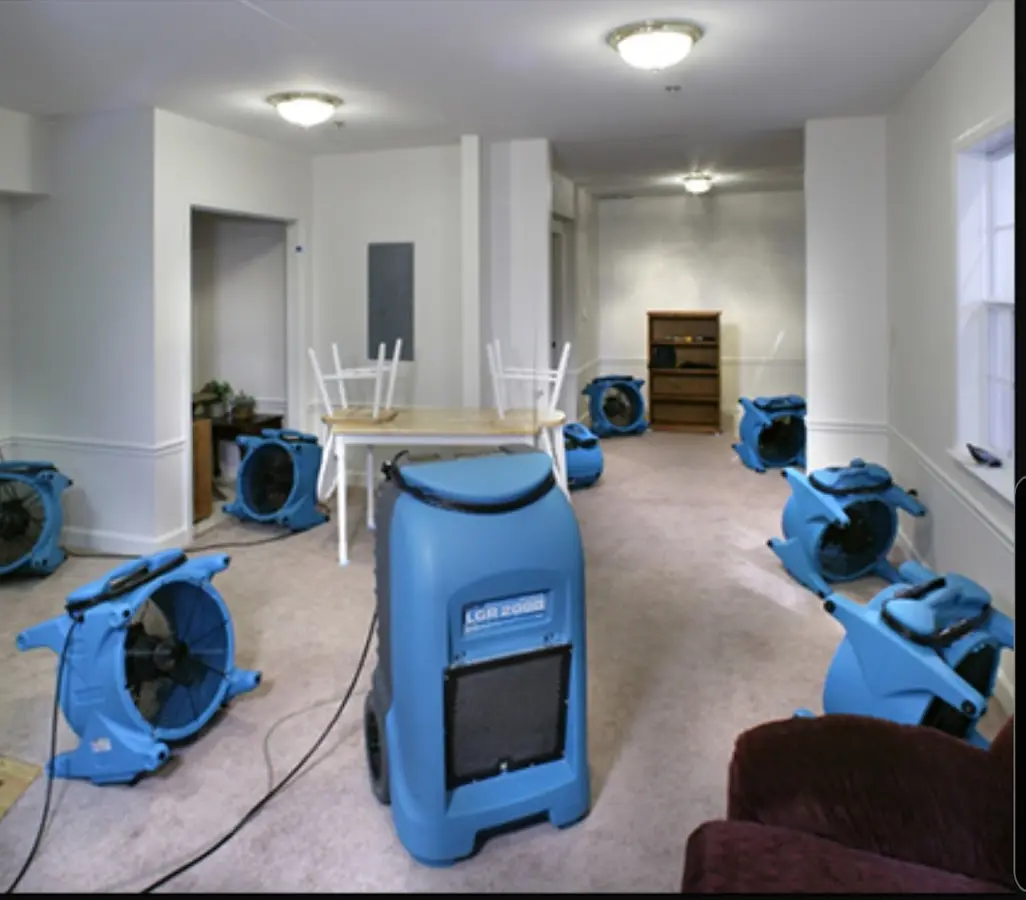 Air movers and dehumidifier setup for Water Damage Restoration in Erie